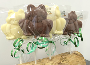 A selection of white and milk chocolate frogs